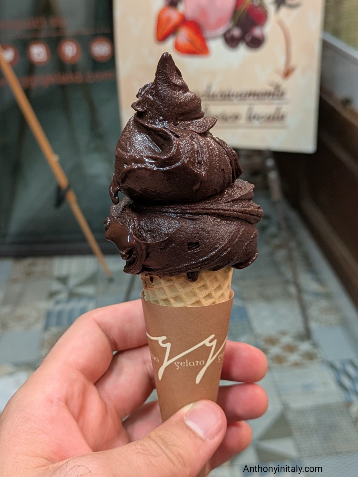 Close-up of a rich dark-chocolate gelato cone from Oggi Gelato in Udine
