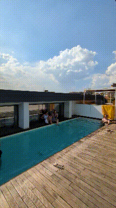 short gif showing yellowsquare rooftop pool and distant duomo view
