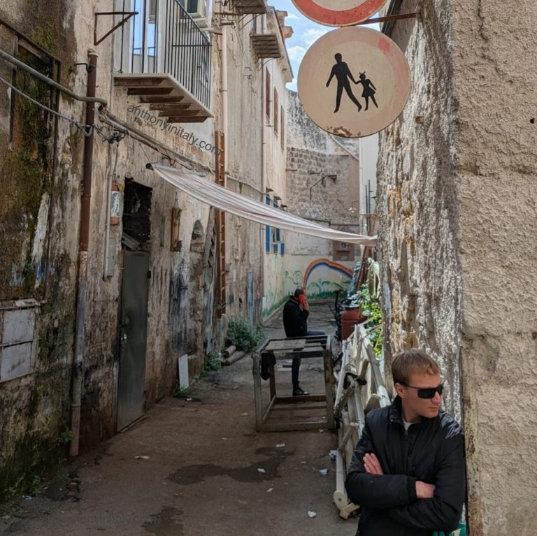 picture of a guy in an alley in palermo, sicily