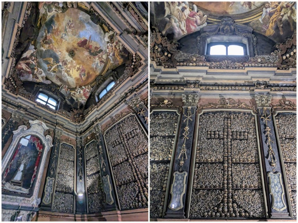 Interior of San Bernardino alle Ossa in Milan, showing walls and columns decorated with human skulls and bones beneath an ornate Baroque fresco ceiling.