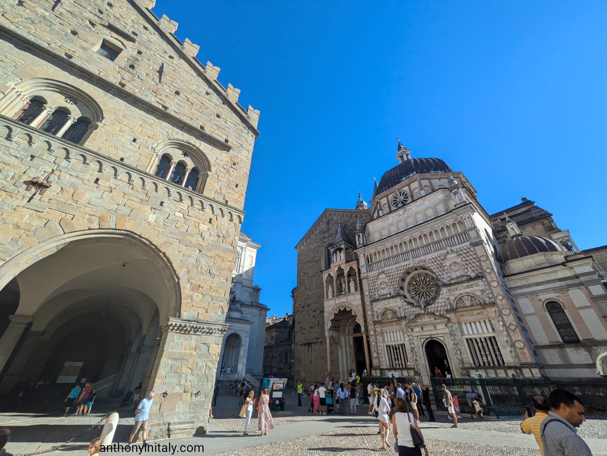 Palazzo della Ragione and the marble facade of the Cappella Colleoni in Bergamo's Piazza Vecchia, with the Duomo behind