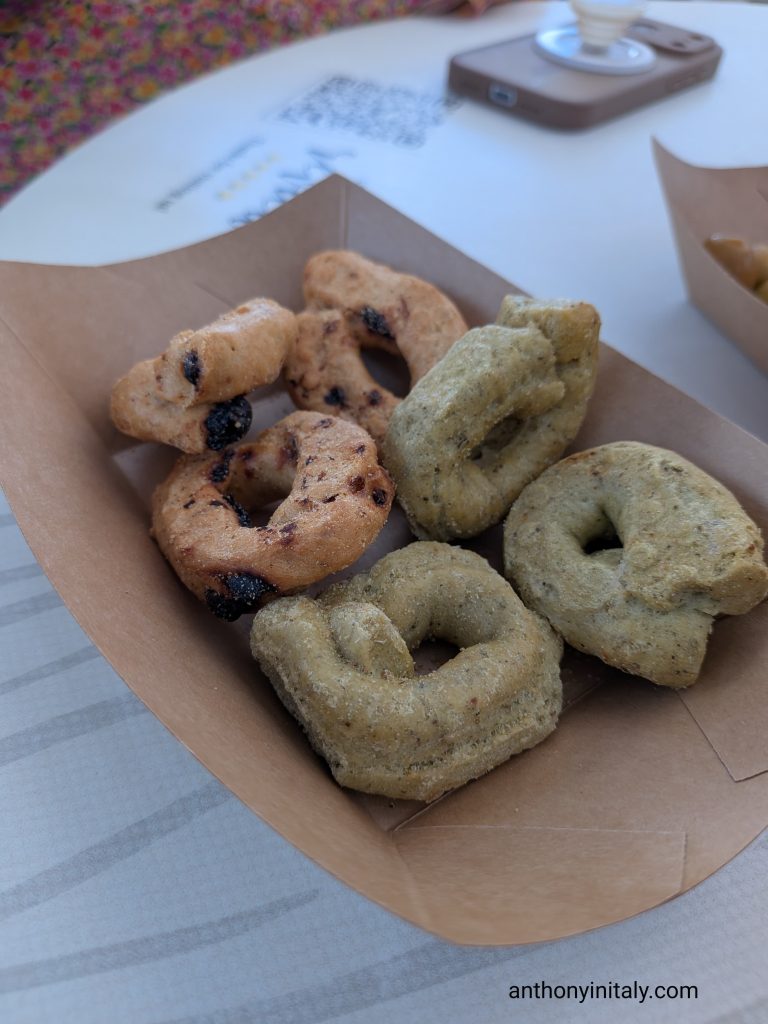Paper tray of taralli, Puglia's ring-shaped crackers, flavored with tomato and herbs