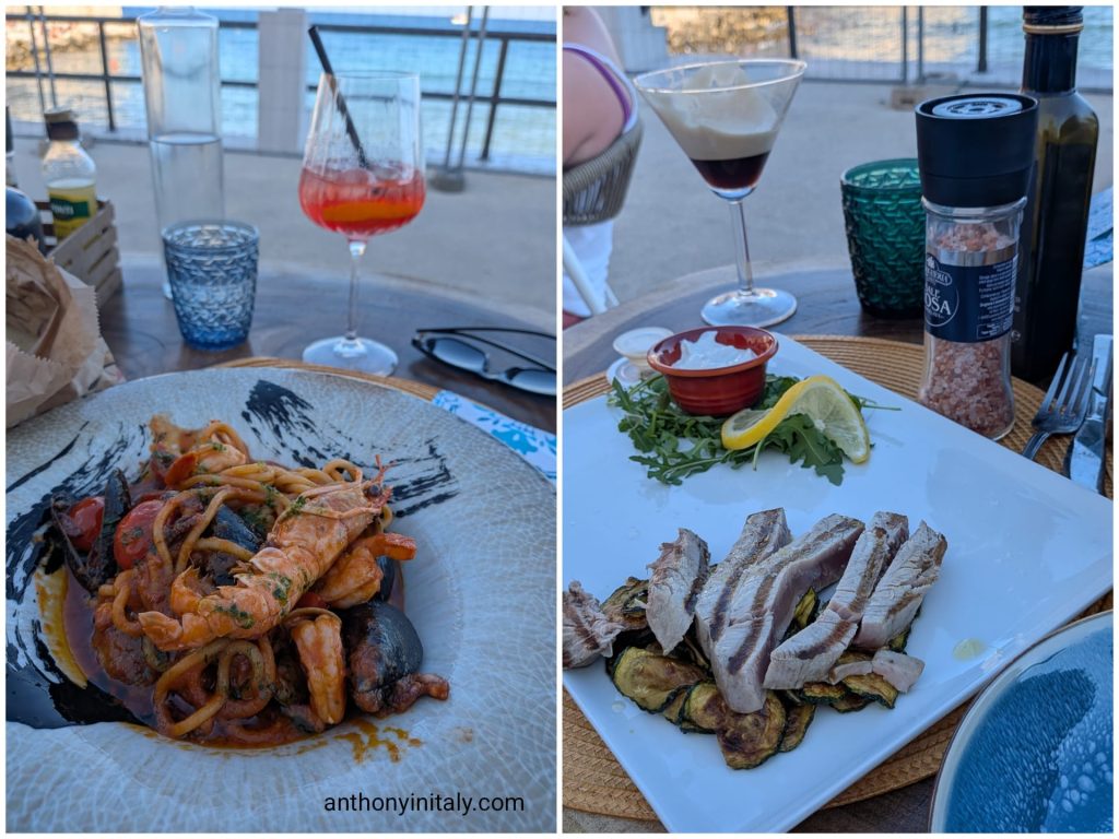 Spaghetti allo scoglio with langoustine and mussels next to grilled tuna on zucchini, at a seaside table in Monopoli