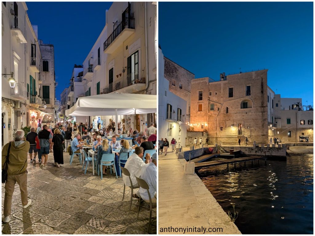 Busy outdoor restaurants in Monopoli's old town at night, and the lit-up old harbor