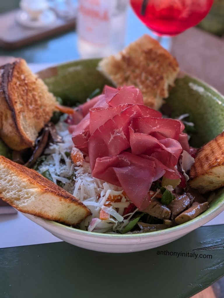 Bresaola salad with shaved cheese, toasted focaccia and a spritz at Vini e Panini in Monopoli