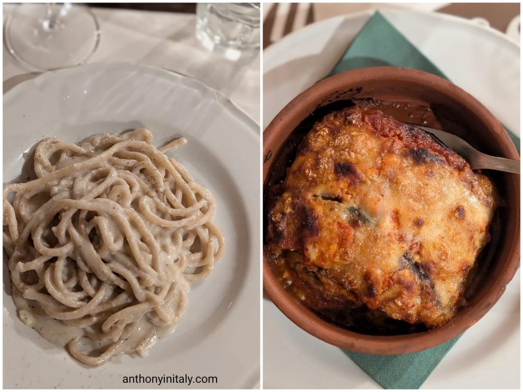 Cacio e pepe with thick handmade pasta, and eggplant parmigiana baked in a terracotta dish at Al Mangiar Bene in Perugia