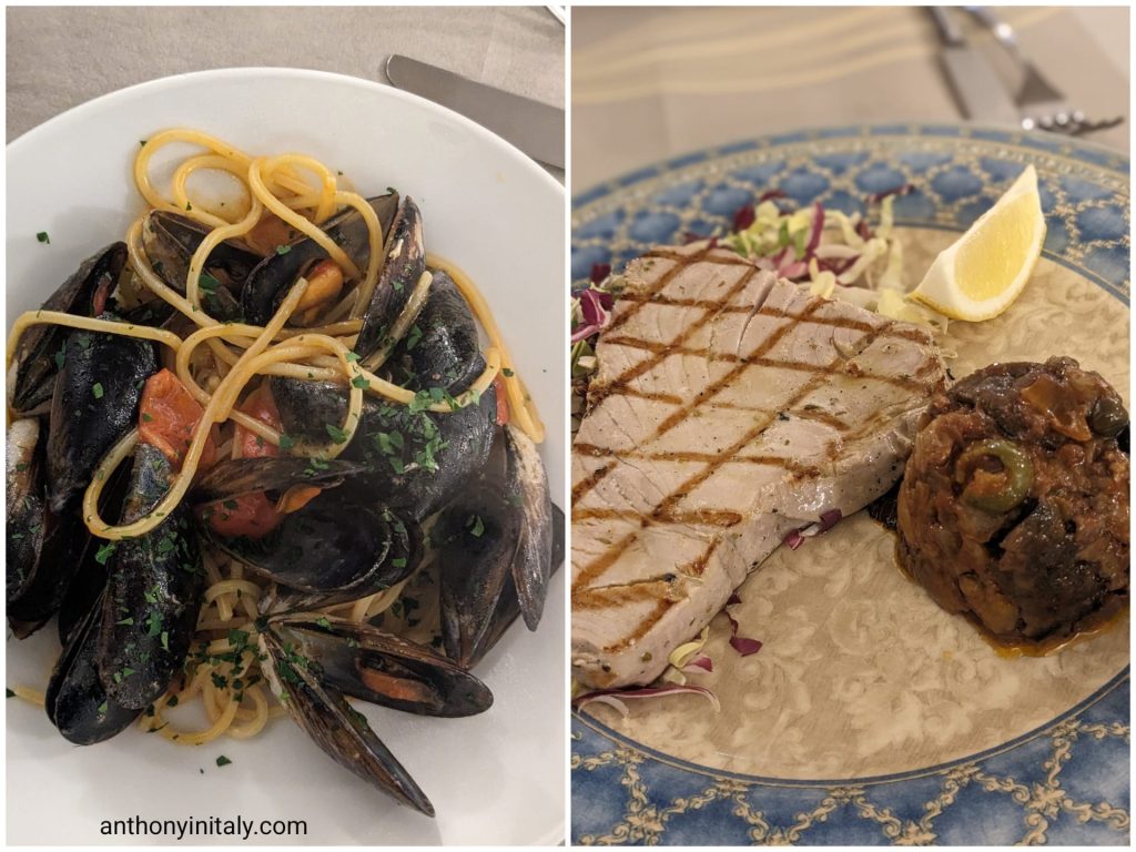 Spaghetti with mussels and cherry tomatoes next to a grilled tuna steak with caponata at Antica Trattoria delle Volte in Perugia