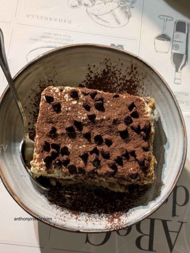 Tiramisu dusted with cocoa and topped with chocolate chips at Osteria a Priori in Perugia
